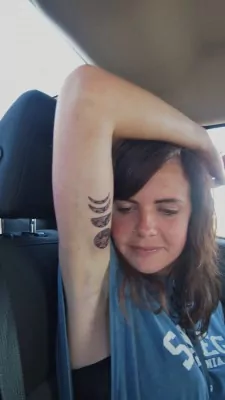 Alex's waning Moon tattoo