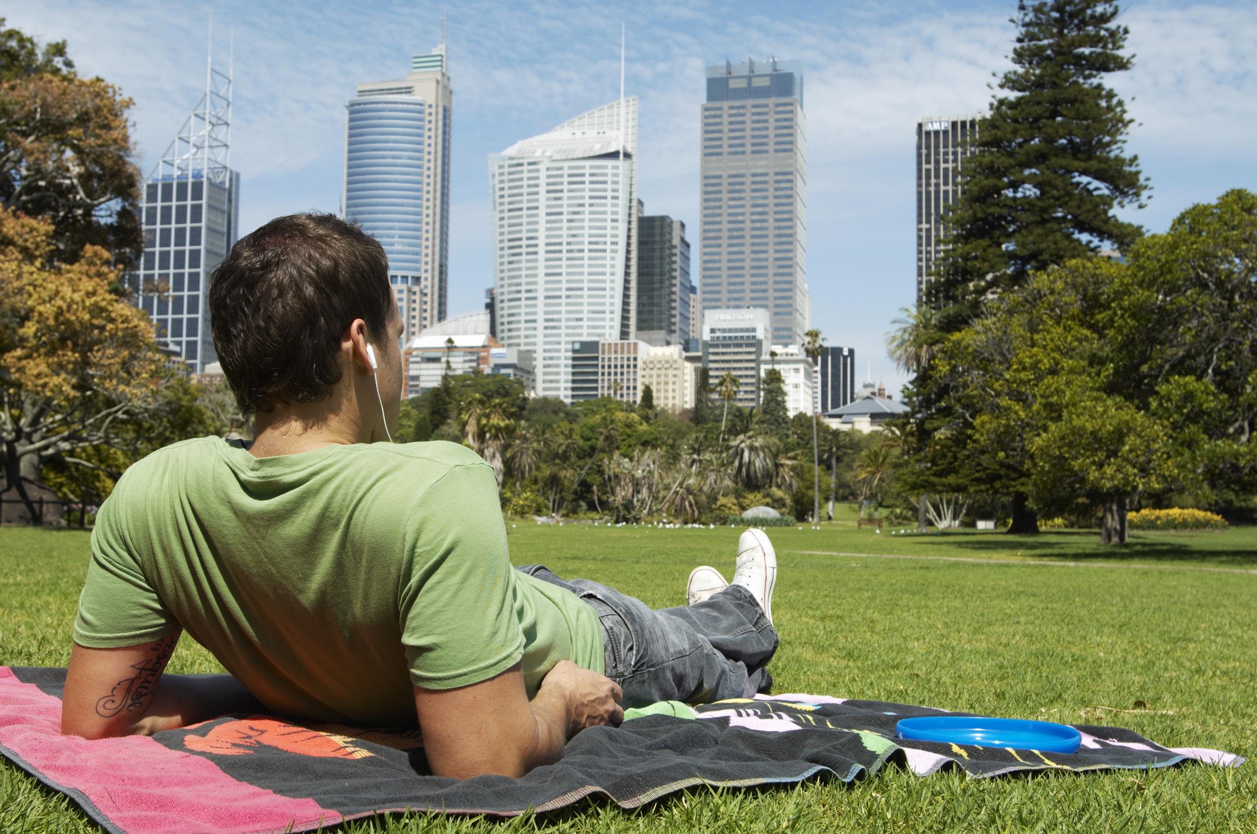 Man sitting in park in Sydney